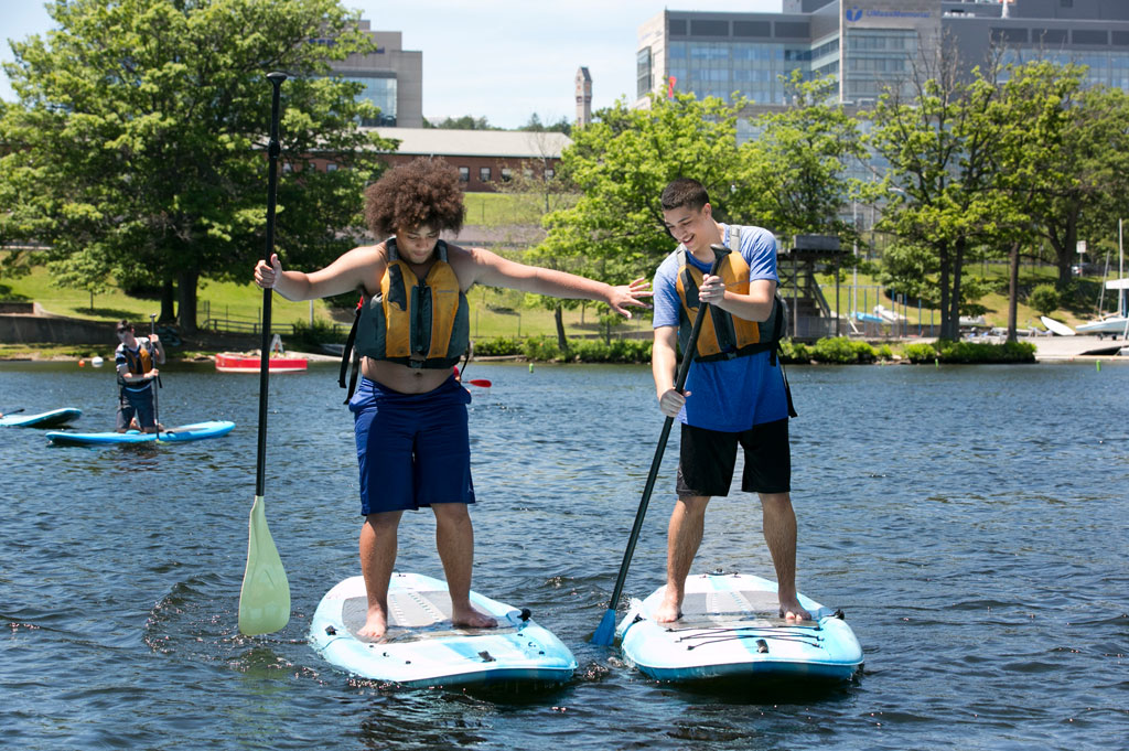 two-teenagers-on-paddleboats