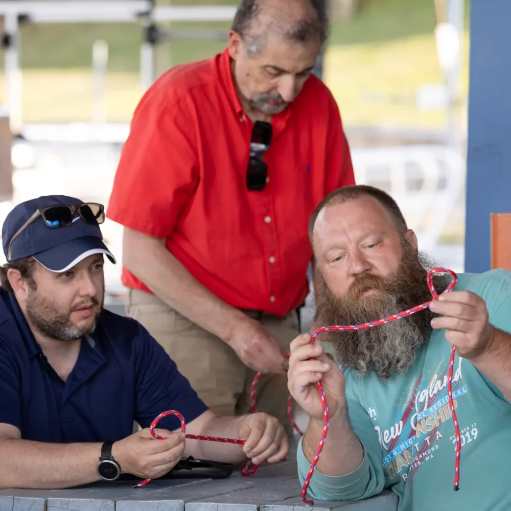 Learning to tie knots during a Regatta Point adult sailing class