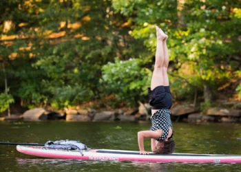 Yoga headstand on a standup paddleboard